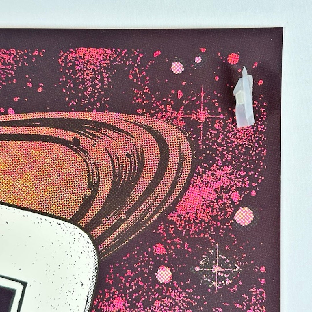top right corner with red space background and planet rings.