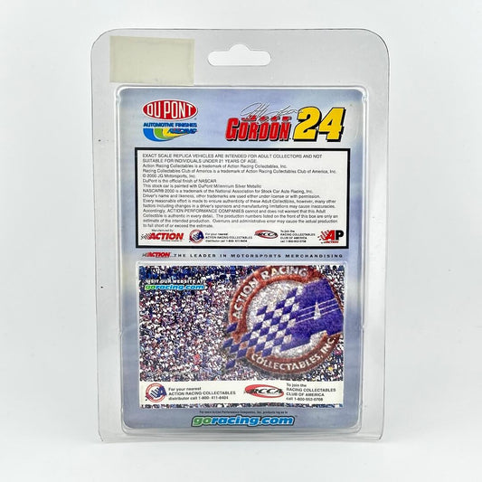 Back of 1:64 scale stock car in original blister packaging, featuring product information and DuPont and Action logos.