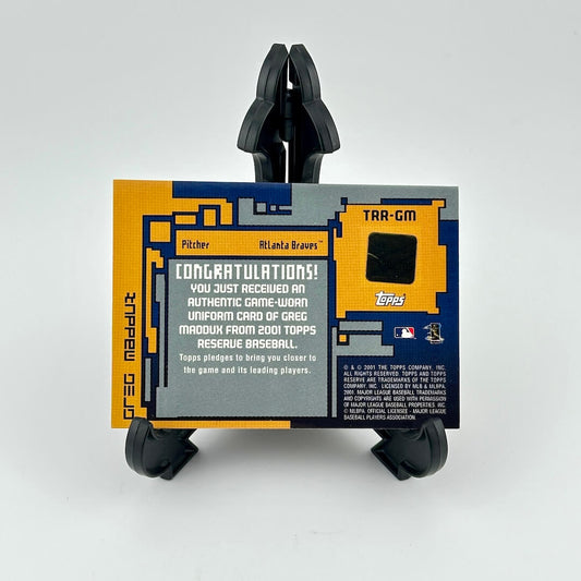 Baseball card holder with a card featuring text and graphics on a white background