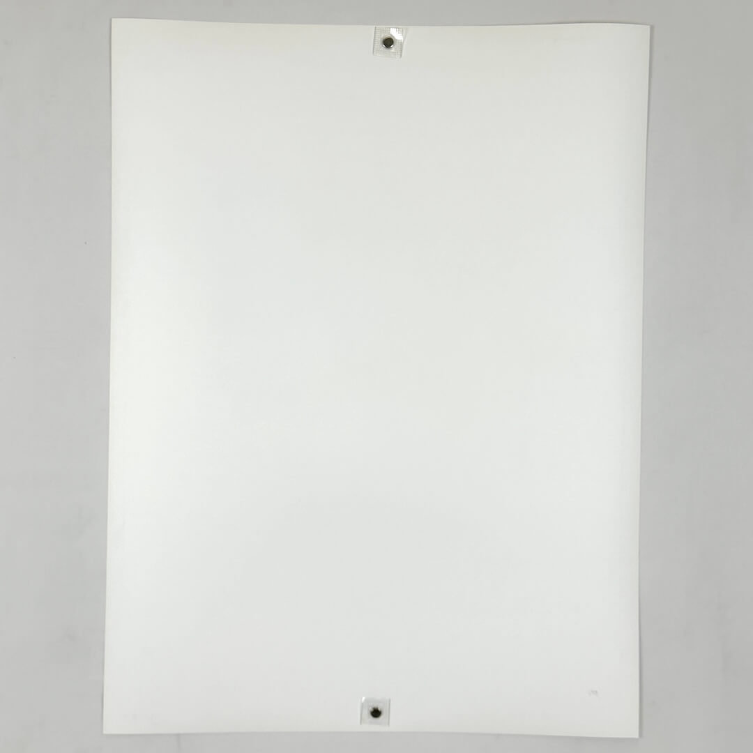 Backside of white poster against white background.