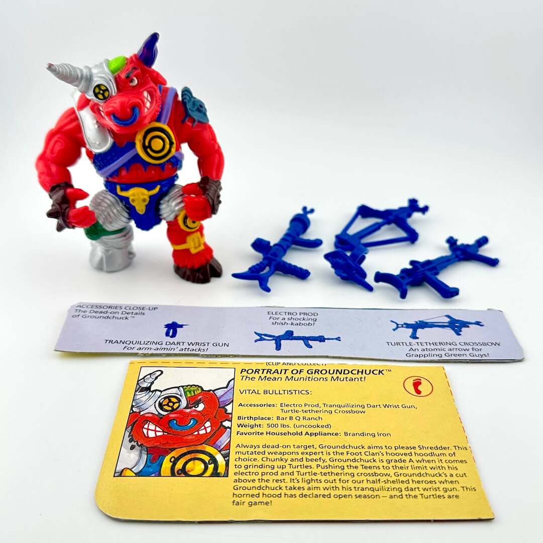TMNT action figure with card back and accessories against white background.