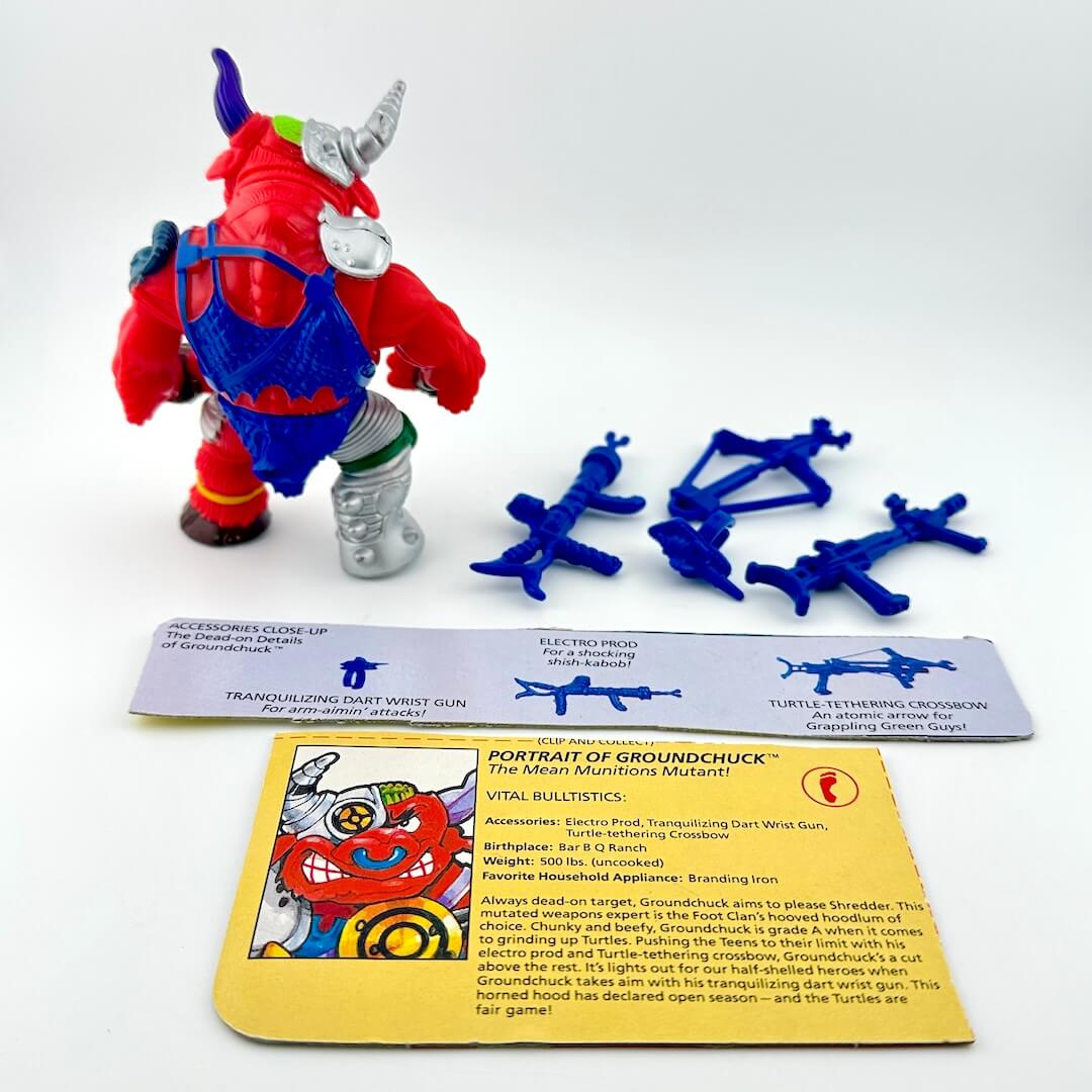 TMNT action figure with card back and accessories against white background.