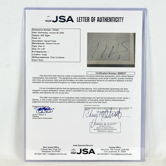 JSA letter of authenticity with a signature on a gray background