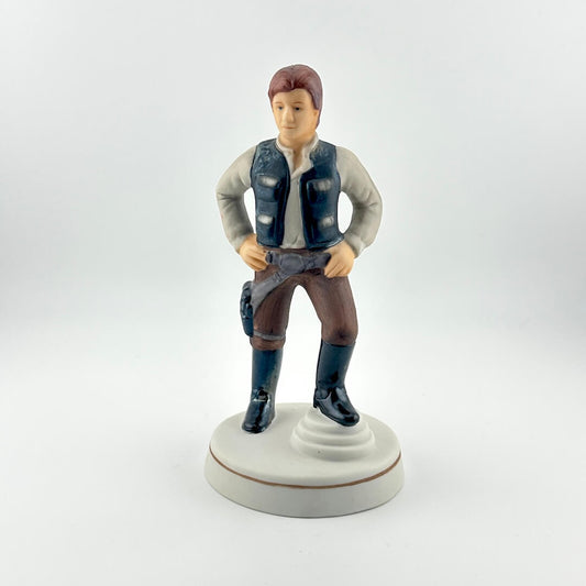 Figurine of a character in a vest and pants on a white background