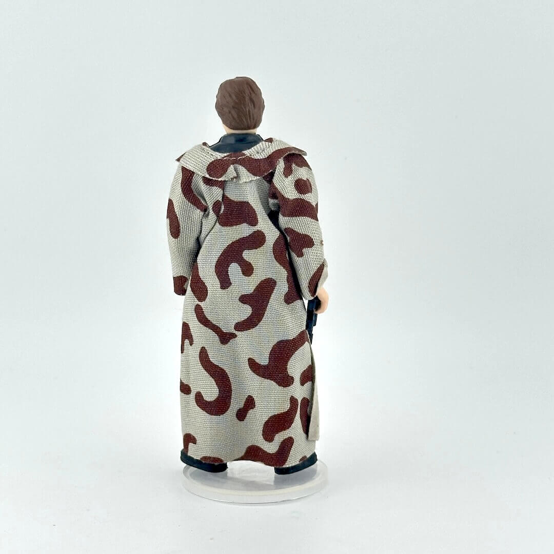 Action figure with a patterned coat on a white background