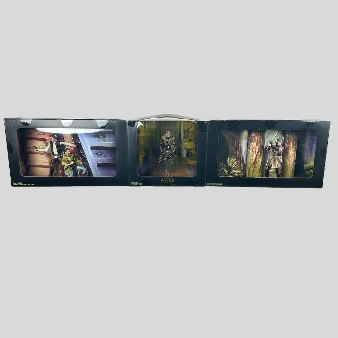 Star Wars action figures in their original packaging unfolded to show each window with posed figures.