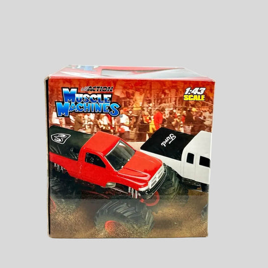 Boxed toy truck with "Muscle Machines" branding against white background.