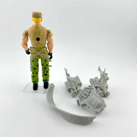 GI Joe action figure with accessories against white background.