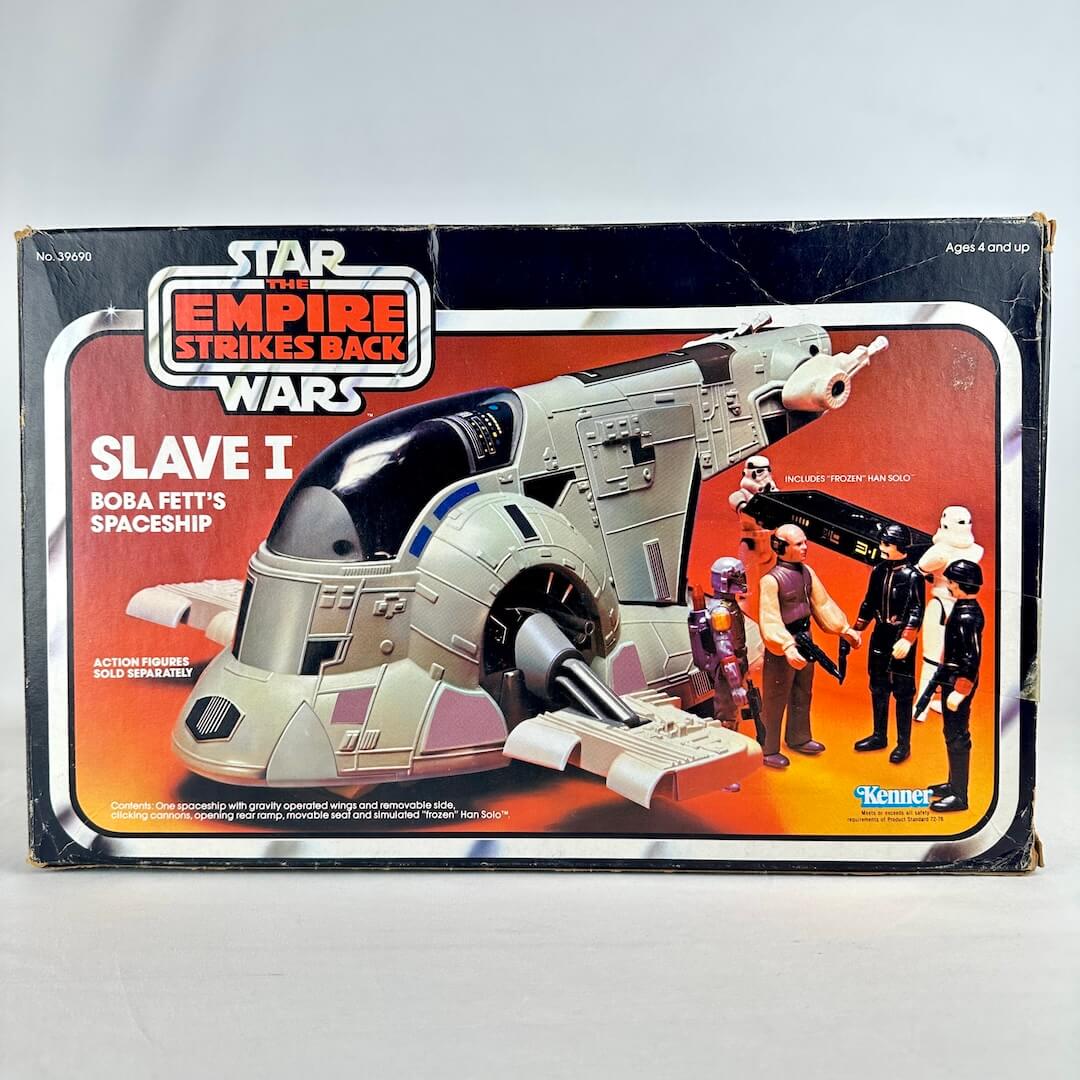 Vintage 'Star Wars' Slave I toy box with characters on a gray background