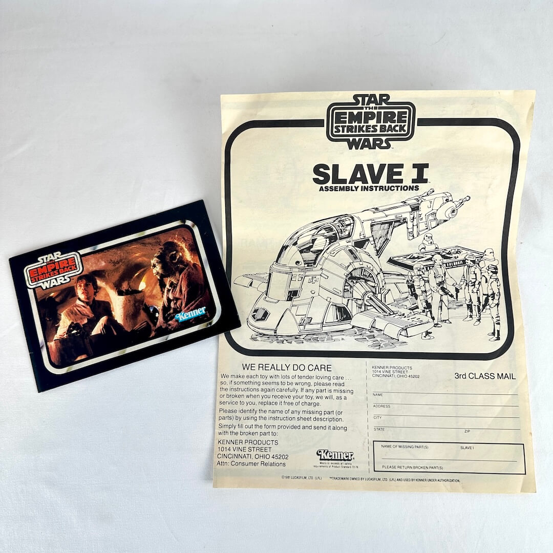 Star Wars Slave I assembly instructions with catalog booklet on a light gray background