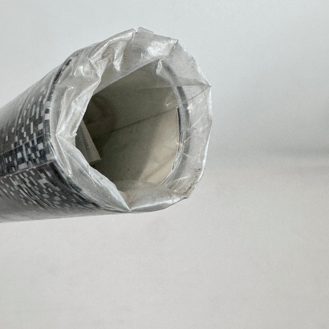 Rolled poster with a clear plastic cover on a light gray background