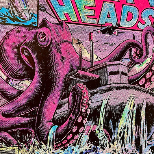 Close-up of central octopus image attacking a boat, glitter foil detailing visible.