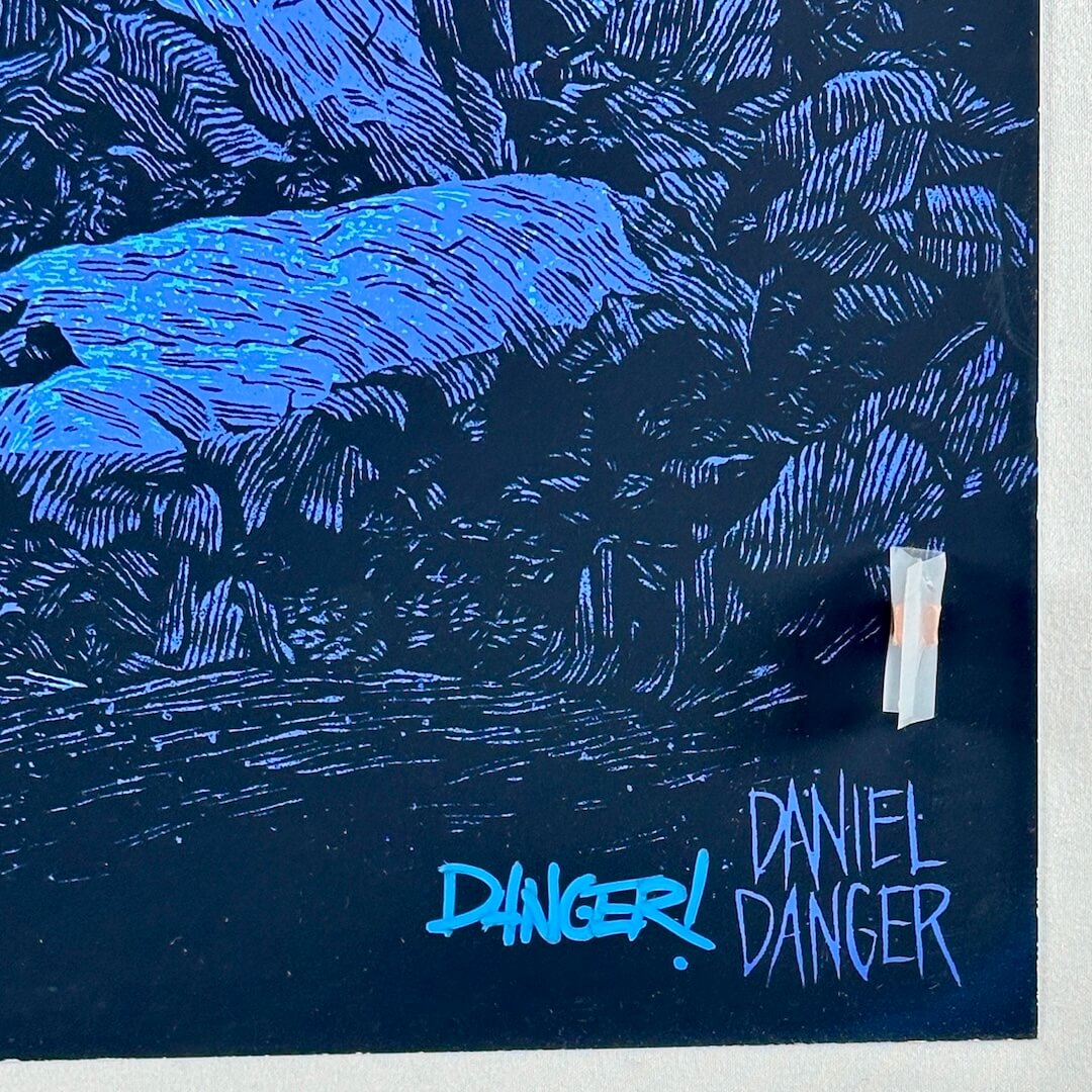 Bottom right corner with artist mark and blue marker signature - unusual for this artist who usually uses pencil.