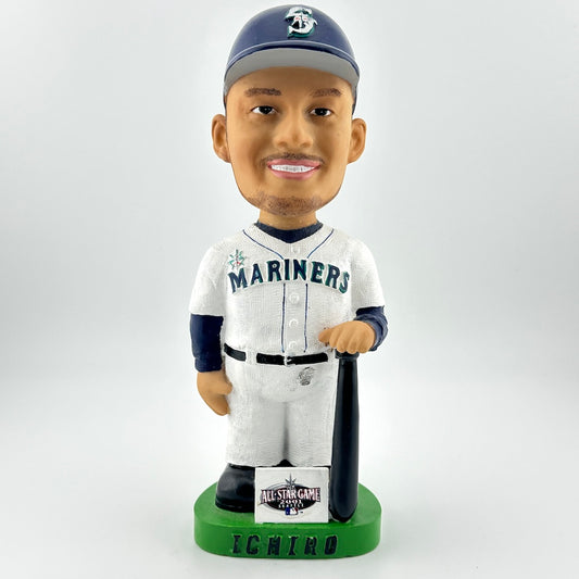 Bobblehead figure of a baseball player in a Mariners uniform holding a bat on a white background