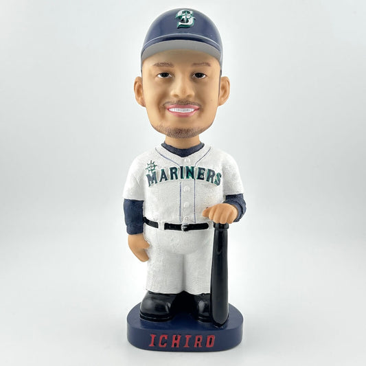 Bobblehead figure of a baseball player in a Mariners uniform on a white background