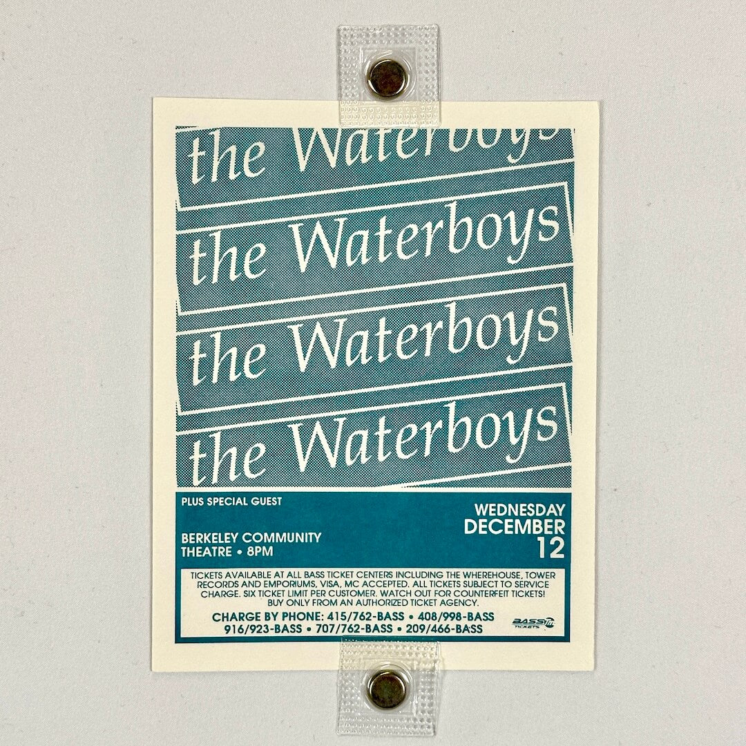 Poster for 'the Waterboys' event with blue and white design on a gray background