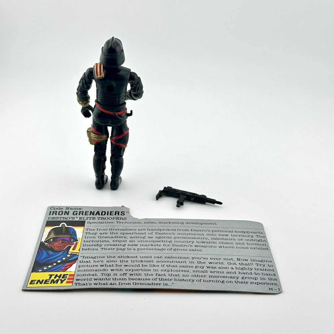 G.I. Joe action figure with character card against white background.