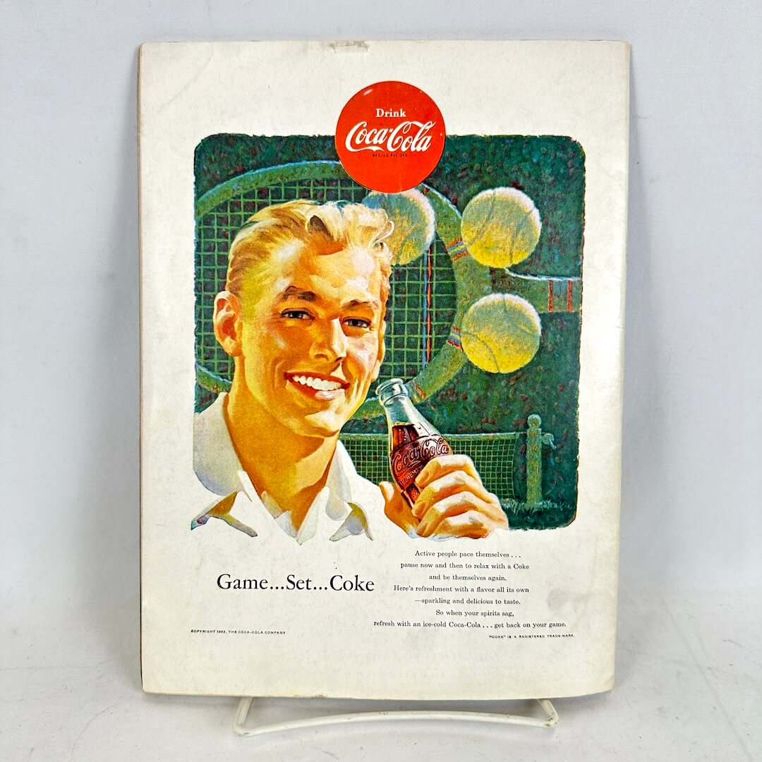 Vintage Coca-Cola advertisement featuring a man holding a bottle with tennis ball graphics.