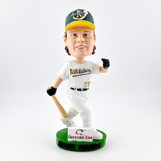 Baseball bobblehead figure in a white uniform with a green cap, holding a bat on a white background.