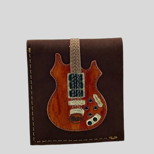 Dark brown leather wallet with cherry wood guitar, Rosebud, stitched to front.