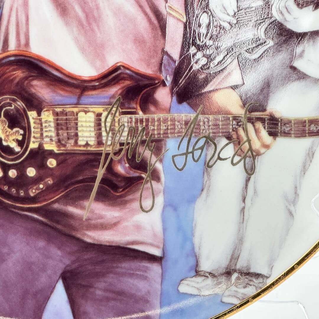 Close-up of Garcia's signature in gold against images of him in background.