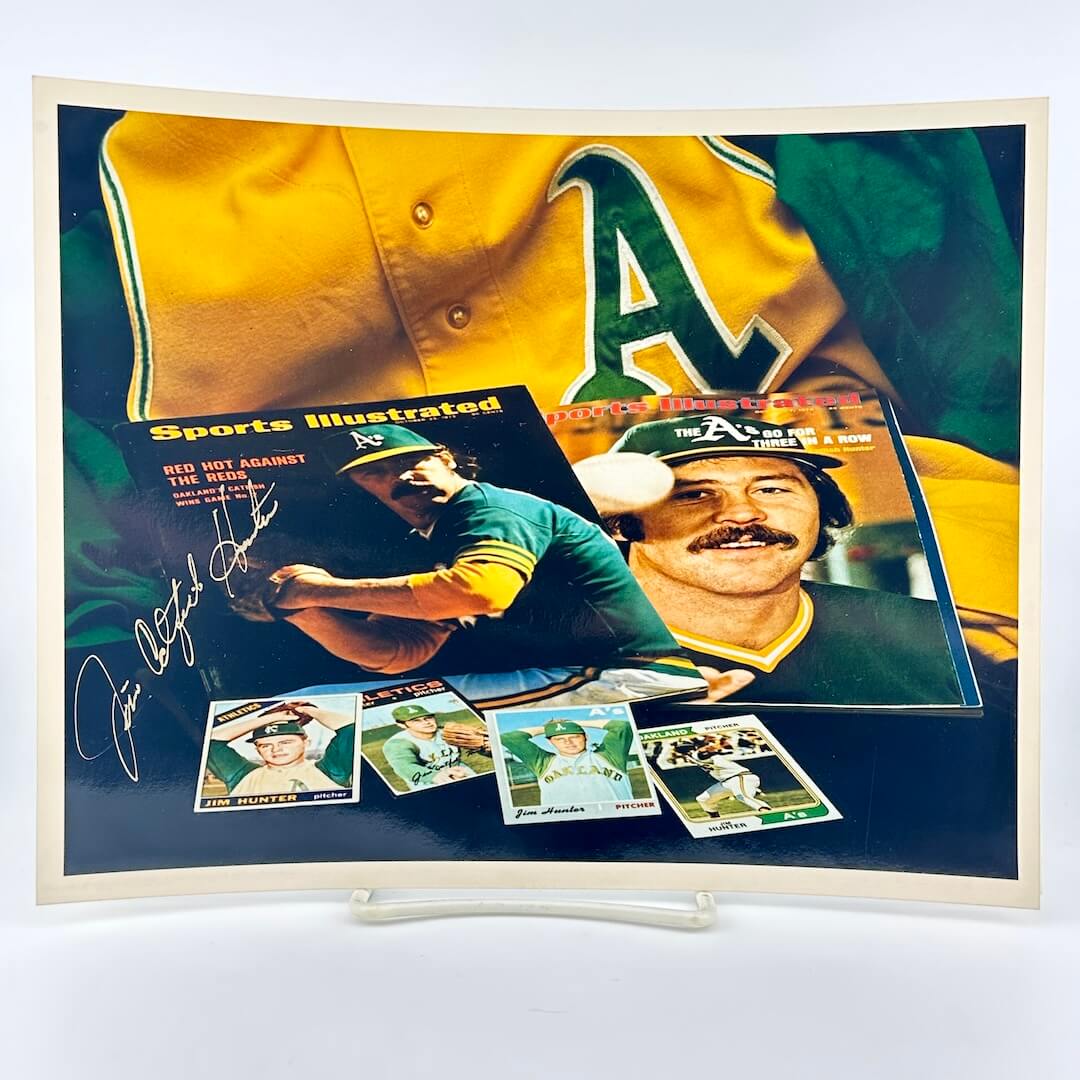 Photo of arranged baseball memorabilia featuring Jim Hunter and his signature.