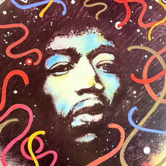 Close up of Hendrix' face showing artwork details.