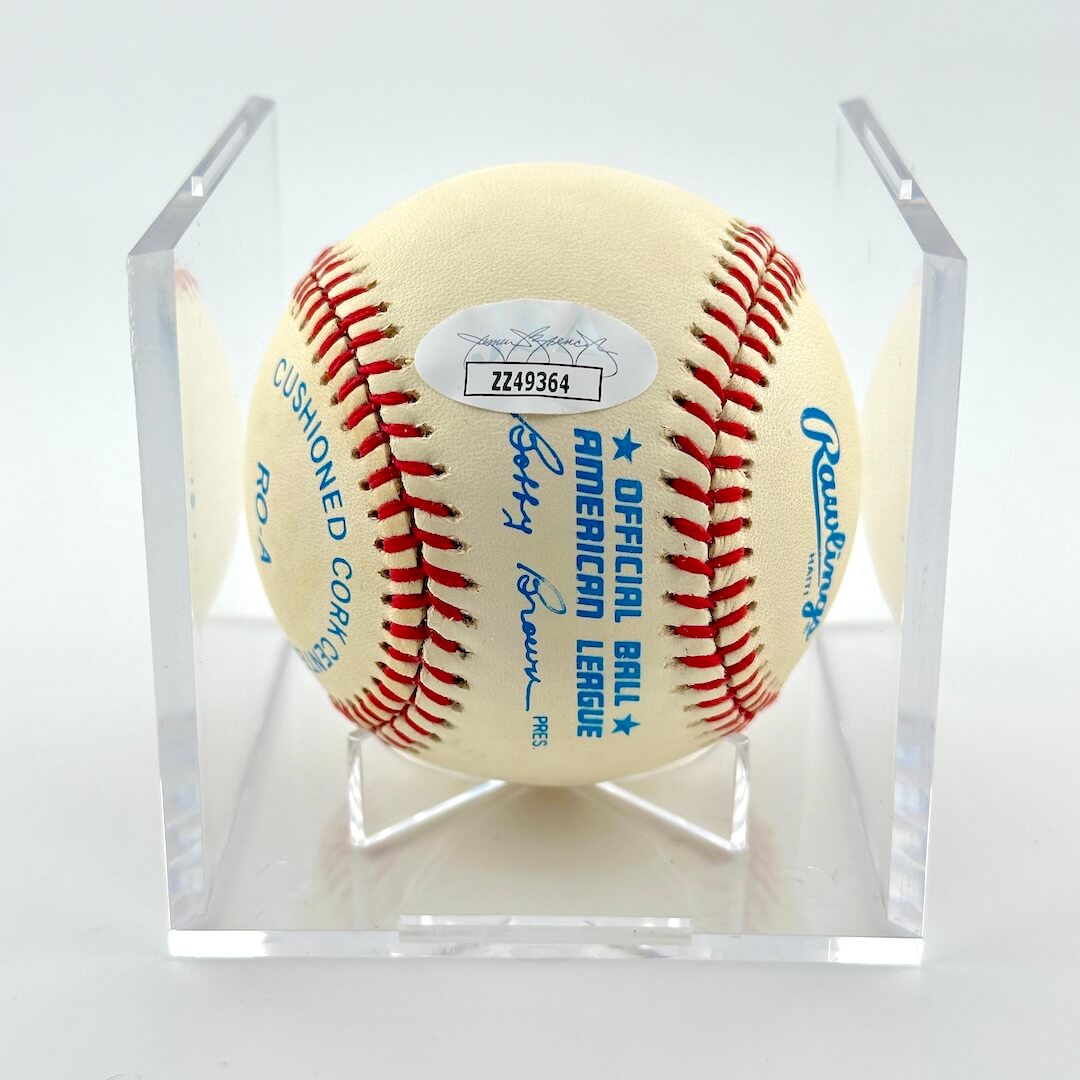 Baseball in a clear display case with 'American League' and 'Rawlings' branding, and JSA sticker.