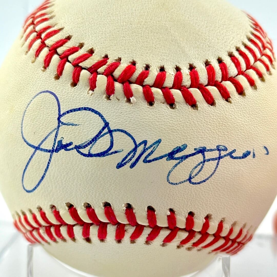 Close up of blue pen signature across sweet spot.