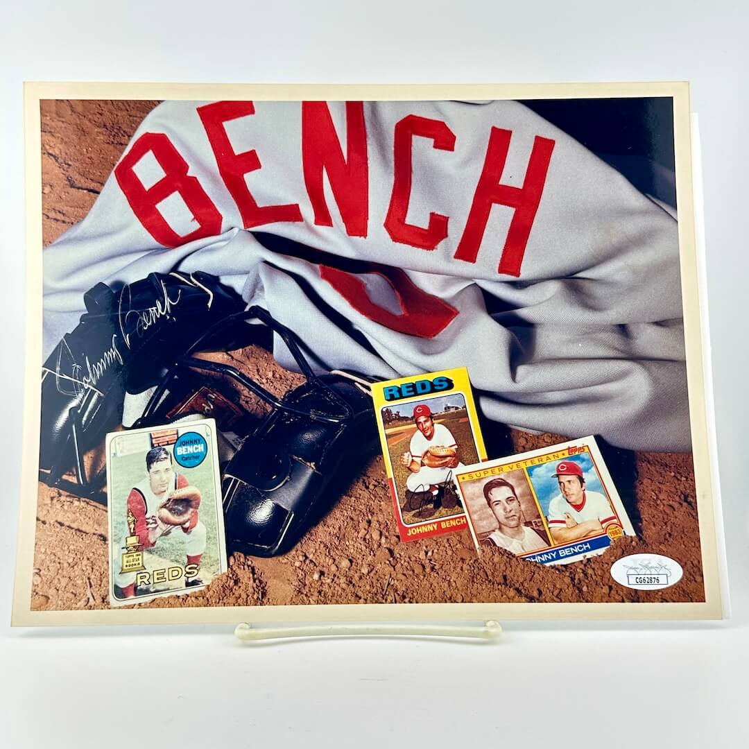 Photograph of memorabilia collage featuring signature of player, JSA authentication sticker in corner.