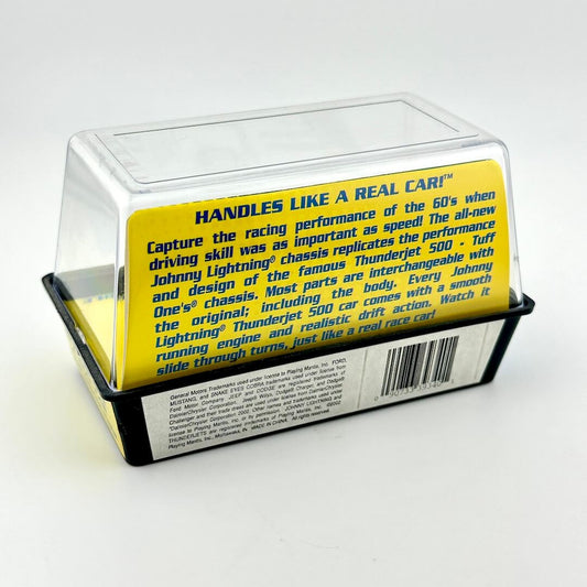 Toy car packaging with a clear lid displaying text about the product's features.