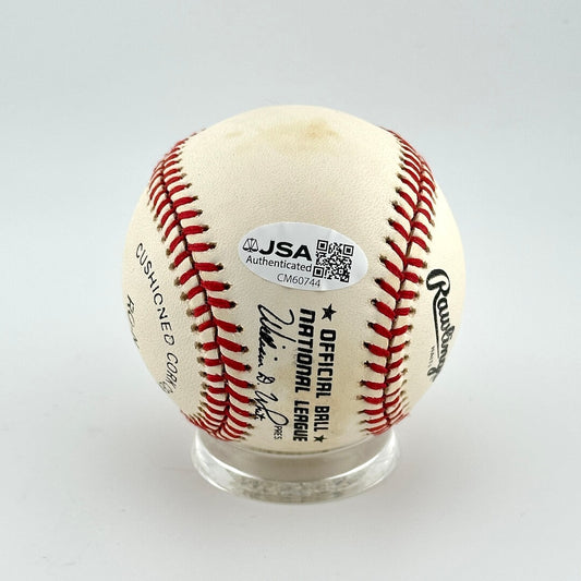 Baseball with JSA authentication label on a white background
