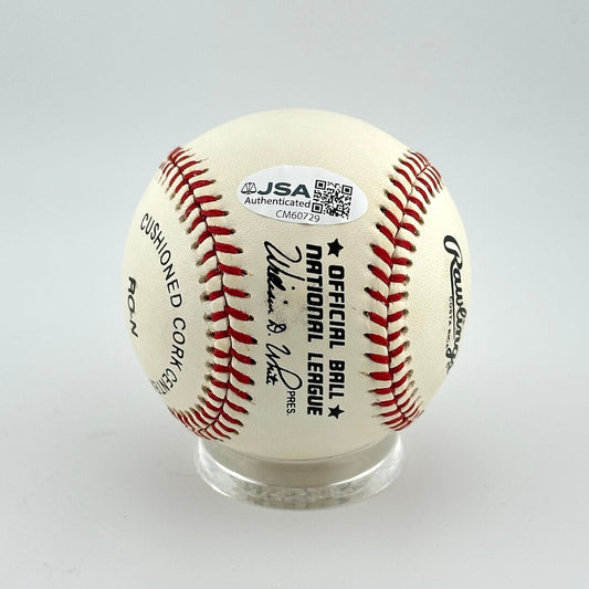 Baseball with JSA authentication label on a gray background