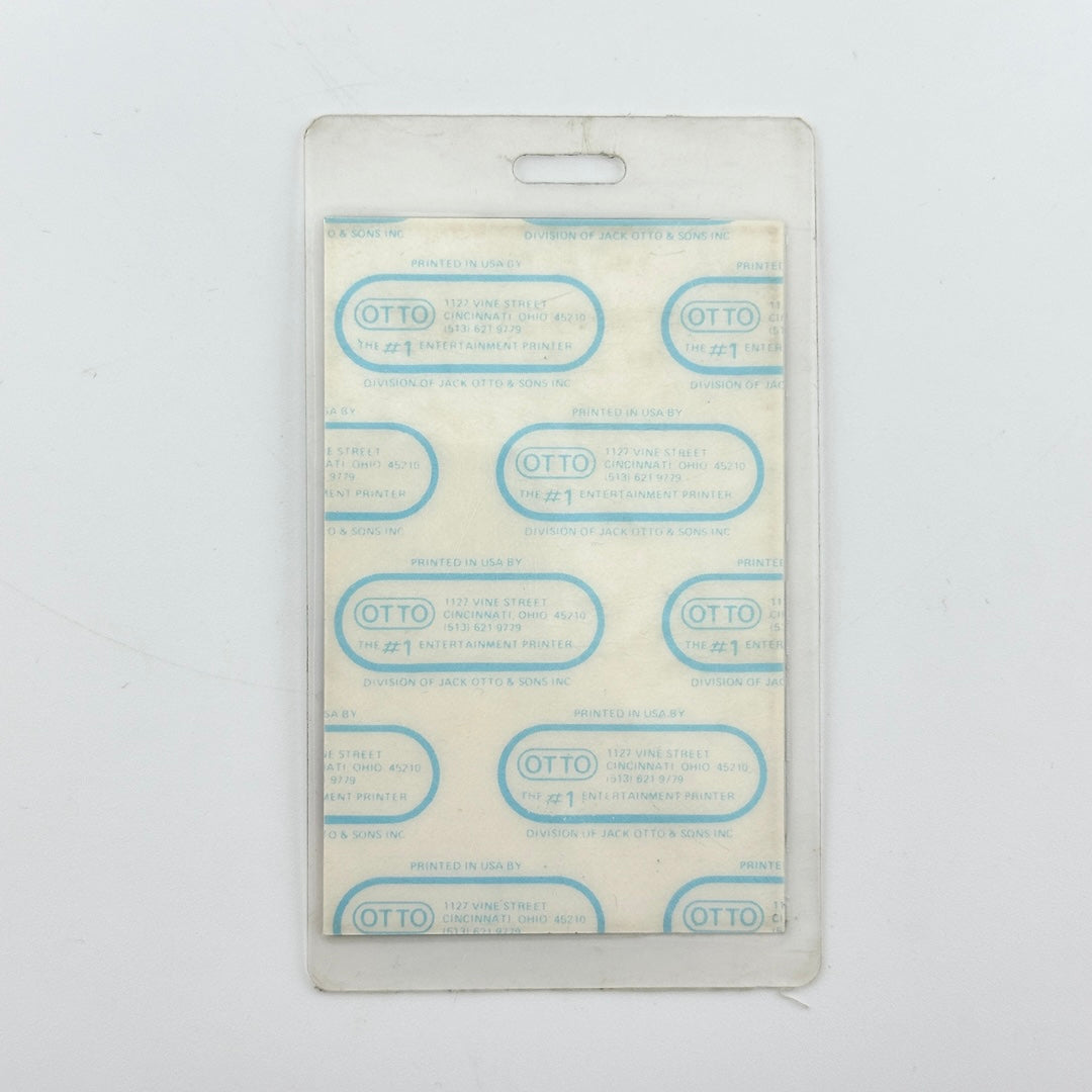 backside of badge to show intact paper backing and mint condition inside lamination.