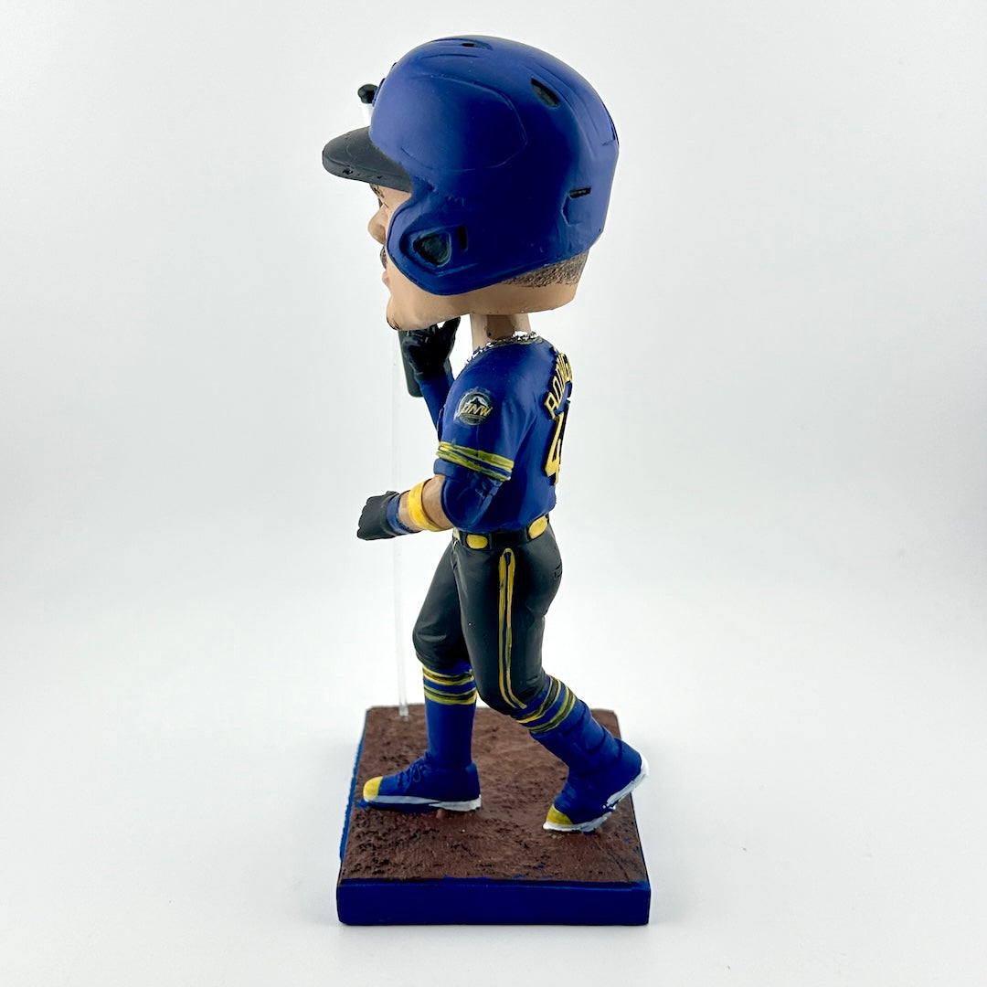 Bobblehead figure of a baseball player in blue uniform with helmet on a white background