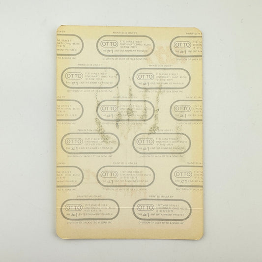 Backside of pass showing intact paper backing and mint condition.