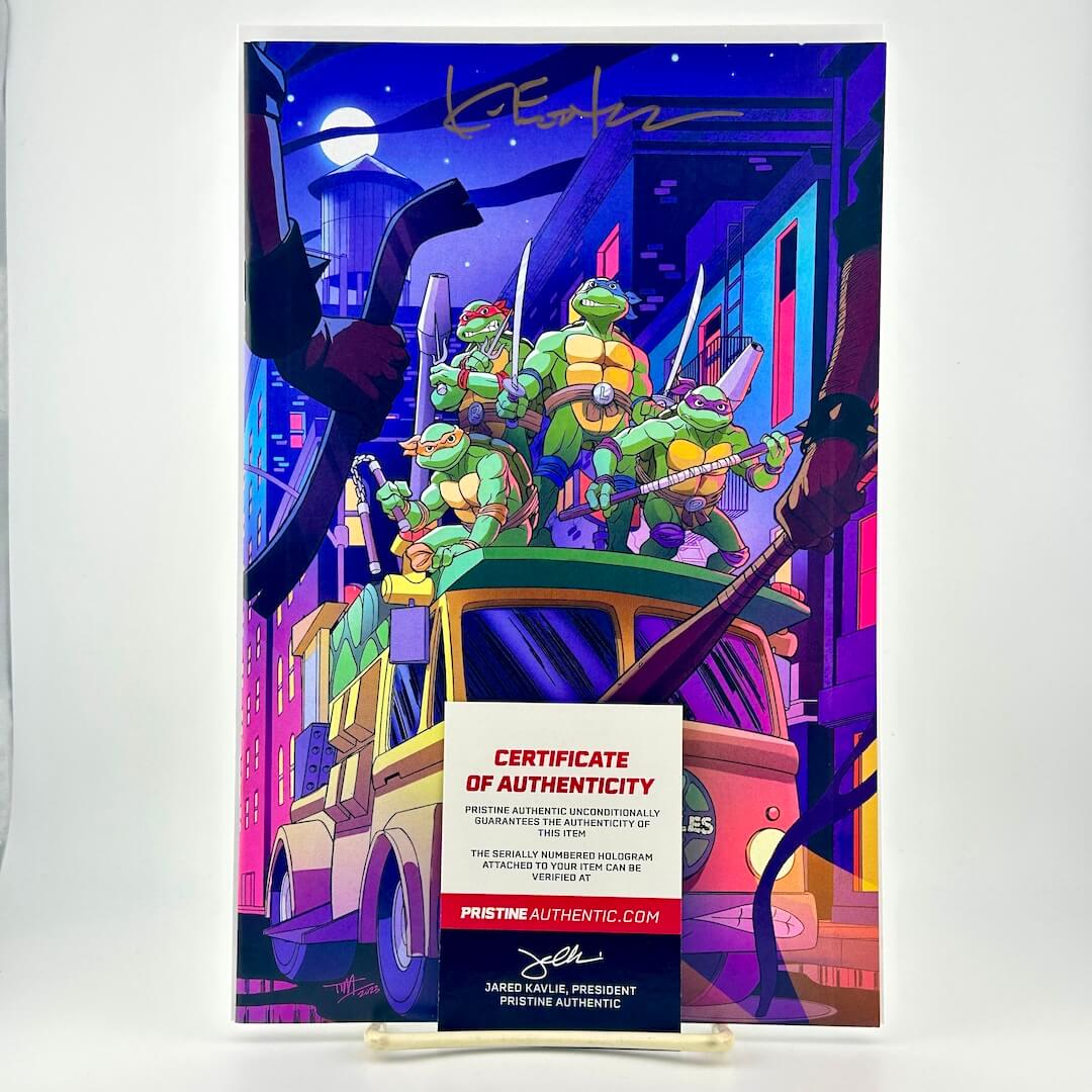 Colorful comic book cover of Teenage Mutant Ninja Turtles on a city street with a certificate of authenticity below.