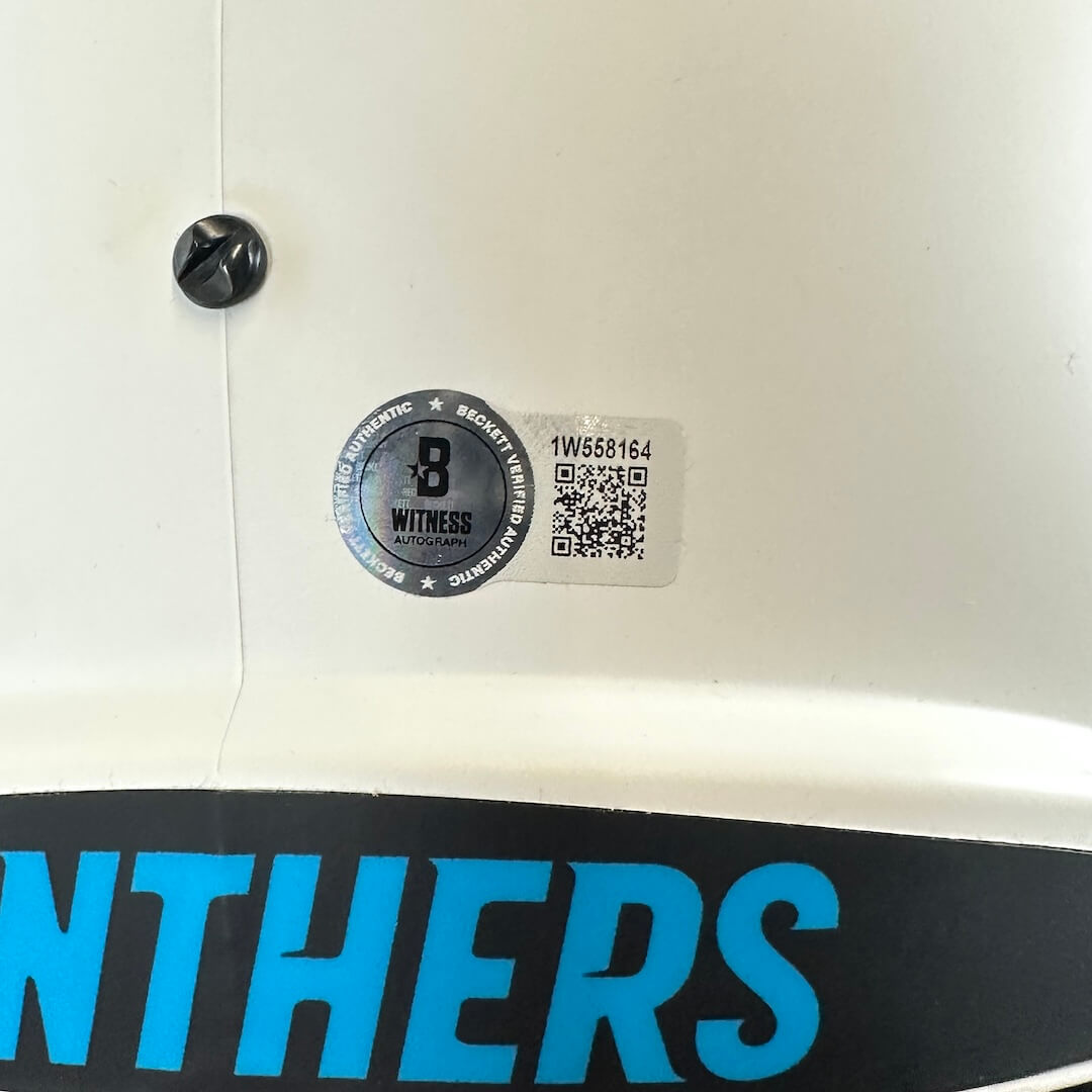 Close up of authentication sticker from Beckett on back of helmet.