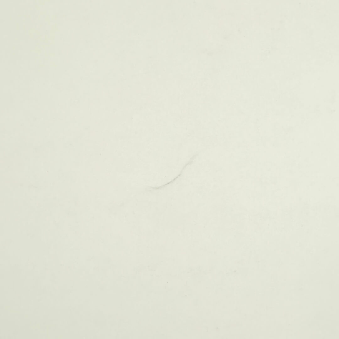 Backside of poster with possible dent towards bottom center.