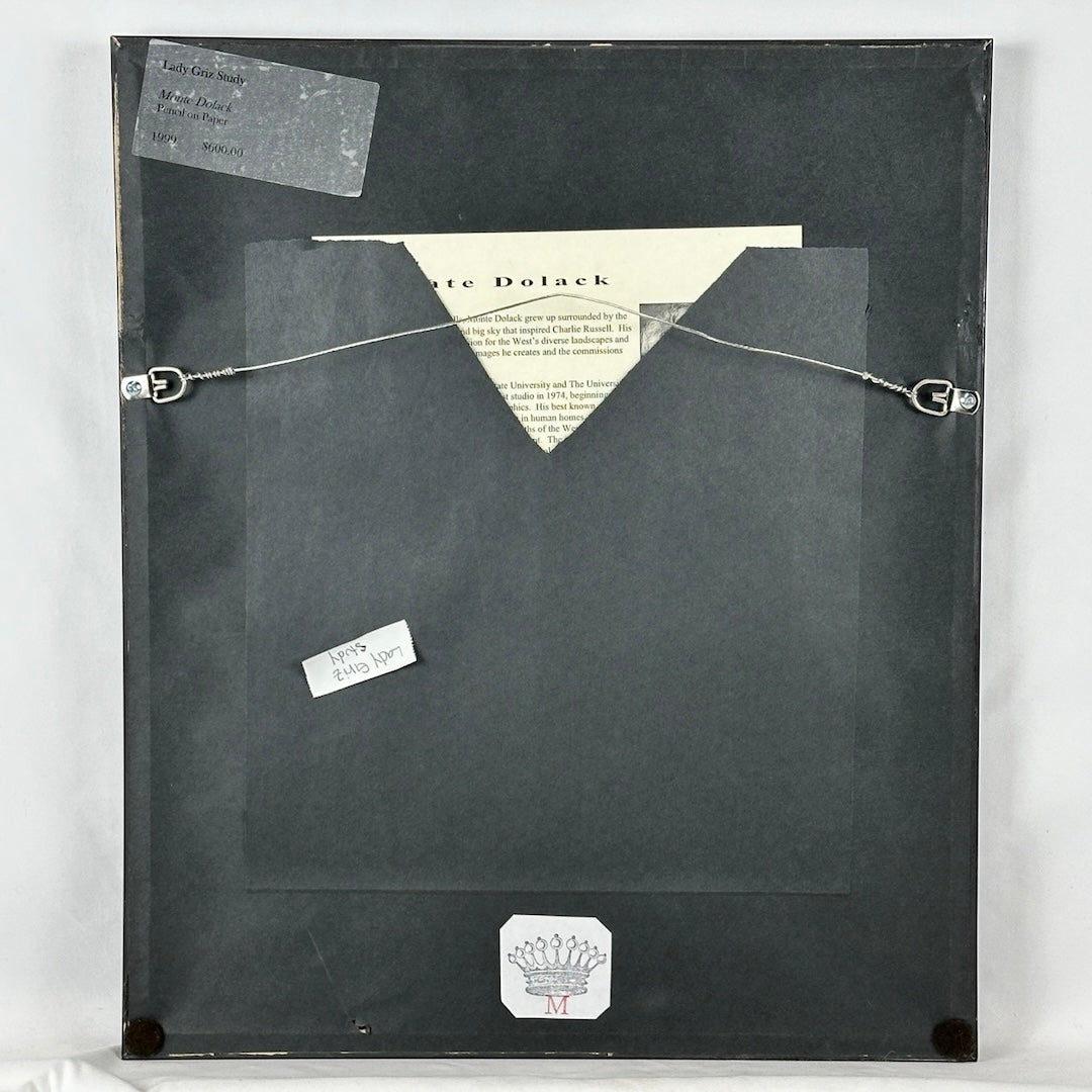 Image of back of frame showing it was framed by artist and has additional info in pouch.