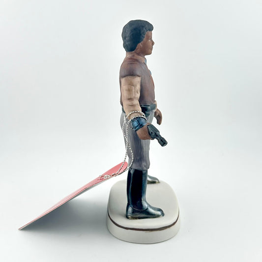 Star Wars Figurine with red tag against white background.