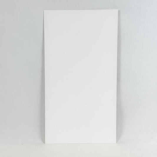 Backside of art print showing a white rectangular paper photographed on a white background.