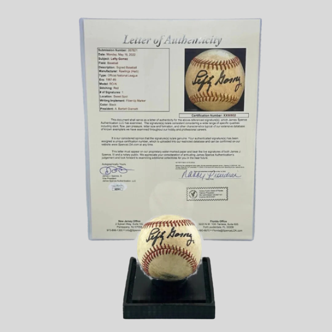 Signed baseball on black base with letter of authenticity from JSA in protective sleeve.