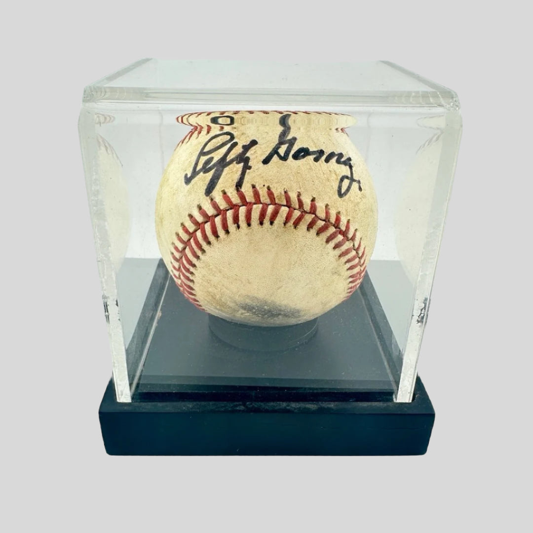 Lefty Gomez Signed Baseball in protective clear acrylic cube with black base.