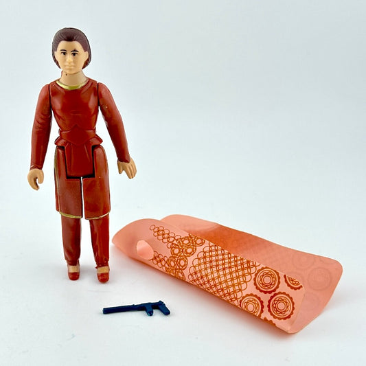 Action figure in red outfit with a pink clothing piece featuring orange patterns on a white background
