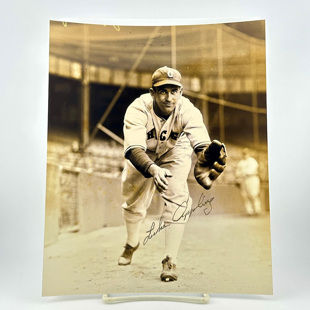 Vintage black and white photo of a baseball player in action with 'Chicago' on his uniform.