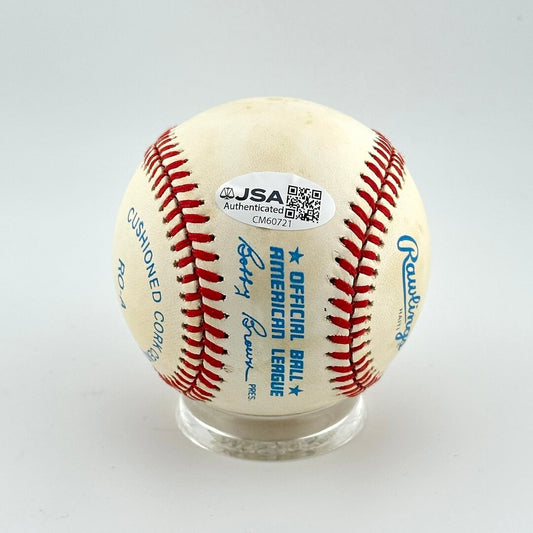 Baseball with JSA authentication label on a gray background