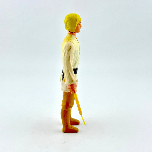 Toy figure in a yellow raincoat and boots holding a yellow umbrella on a white background