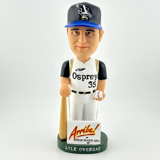 Bobblehead of a baseball player in a 'Osprey' uniform with a bat and ball, on a white background.