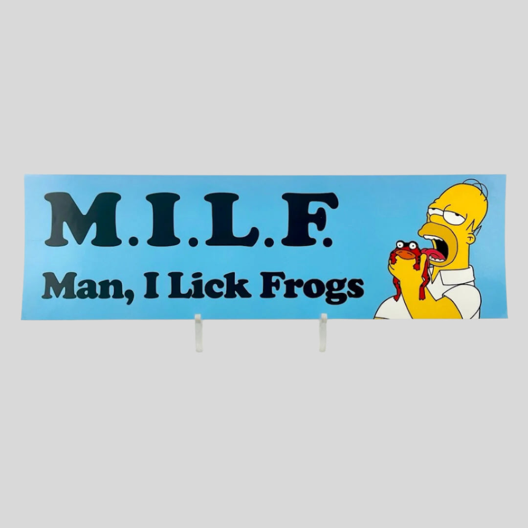 light blue background sticker with Homer Simpson at right licking a red frog next to black text, "M.I.L.F., Man, I lick frogs."